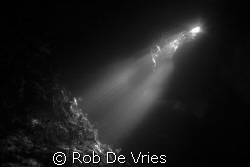 Sunlight in a cave in "the passage" Rajah Ampat, Papua by Rob De Vries 